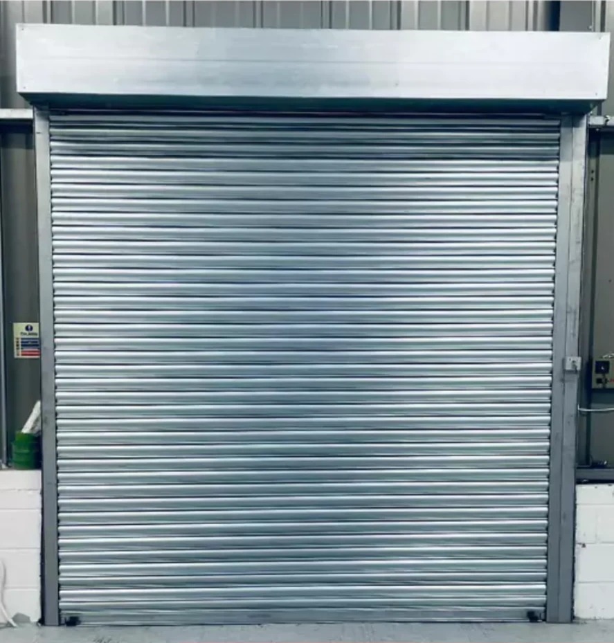 Completed silver roller shutter supplied by Excel