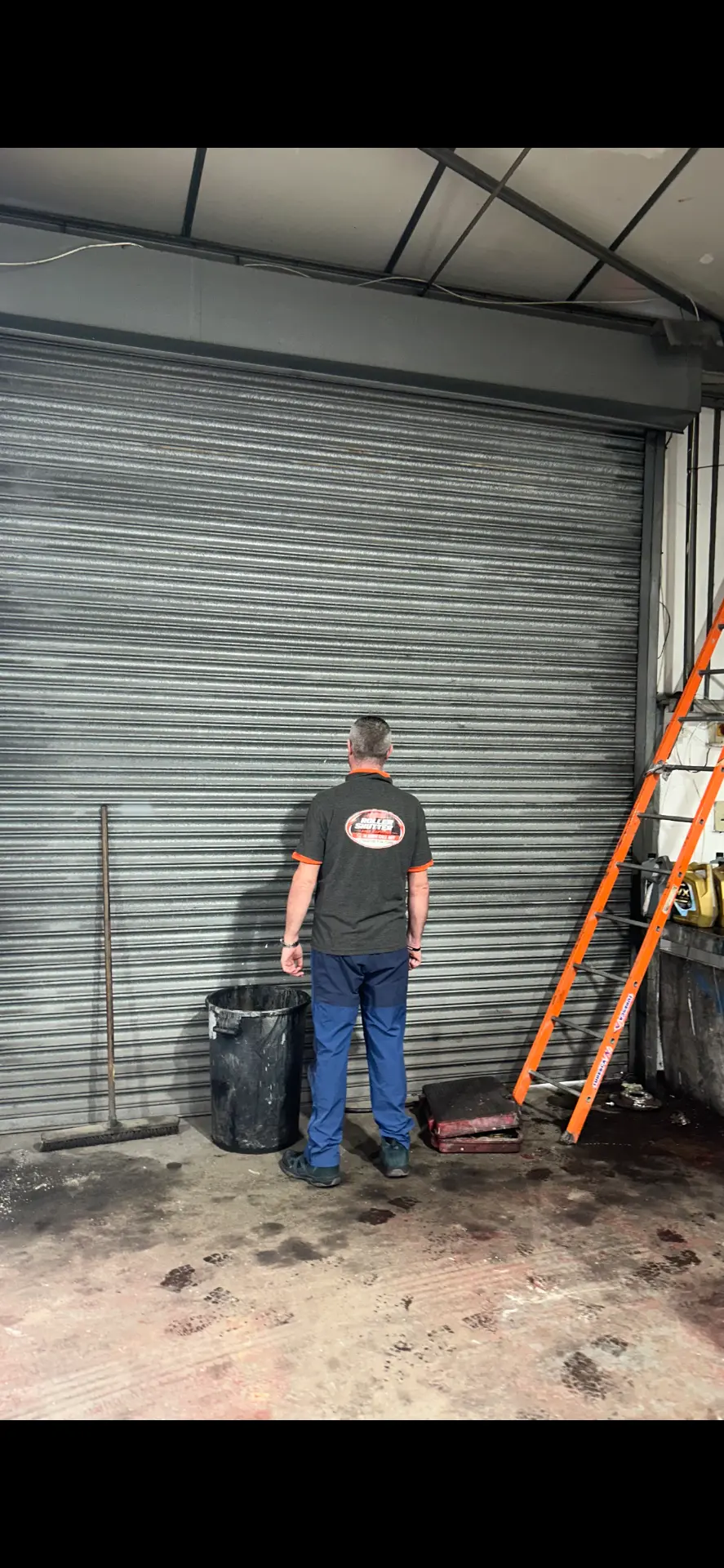 Excel engineer inspecting a large roller shutter